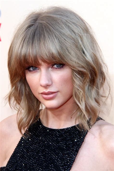 She dyed the tip of her hair blue and it looks amazingly beautiful. Taylor Swift's Hairstyles & Hair Colors | Steal Her Style