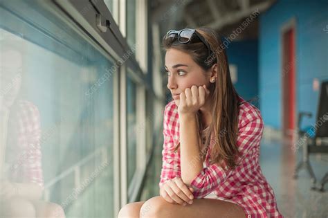 Teenage Girl Looking Through Window Stock Image F0191396 Science Photo Library
