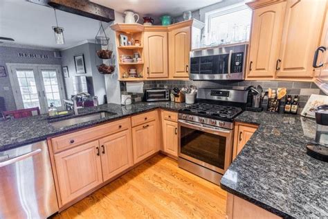 As the saying goes, black matches everything. Black countertops. Wood cabinets | Black countertops, Wood ...