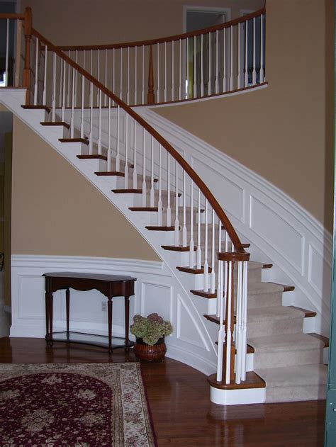 The user sits on the seat, which is secured on a track that is permanently installed along the length of the stairs. Wainscoting along curved stairs | Wainscoting styles, Wainscoting stairs, Stairs trim