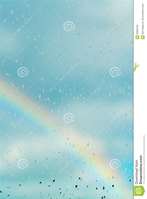 Water Drops On A Window With The Rainbow In The Background