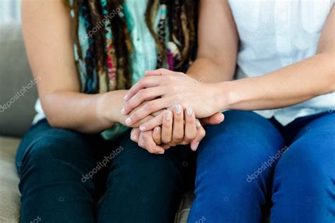 Lesbian Couple Holding Hands Stock Photo Wavebreakmedia 101019848
