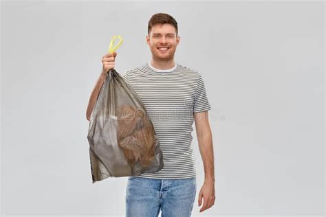 Smiling Man Holding Trash Bag With Paper Waste Stock Photo Image Of