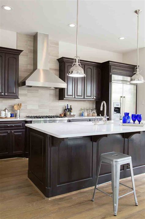Modern kitchen with dark stain shaker cabinets. The Best Wall Colors To Update Stained Cabinets | Rugh Design