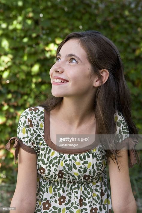 Smiling Preteen Girl Looking Up Photo Getty Images