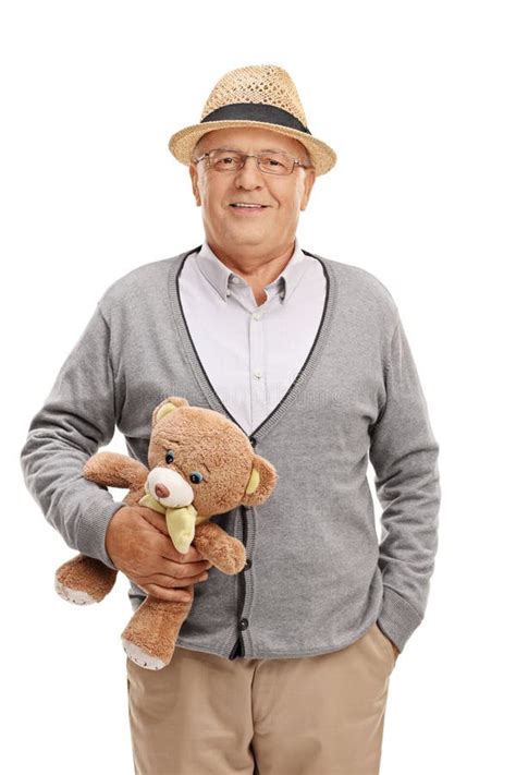 Sweet Senior Gentleman Holding A Teddy Bear Stock Photo Image Of