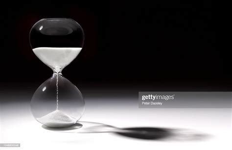 Hourglass Time With Sand Running Through High Res Stock Photo Getty