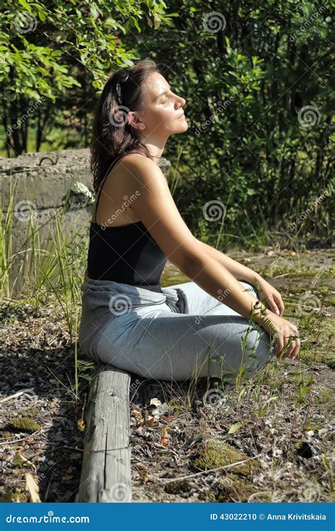 Woman Sitting In Profile On Nature Stock Photo Image Of Exercise