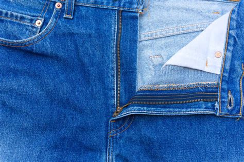 Closeup Of Unzipped And Unbuttoned Blue Jeans Stock Photos Pictures