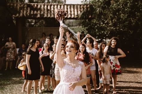 why do brides throw their bouquet