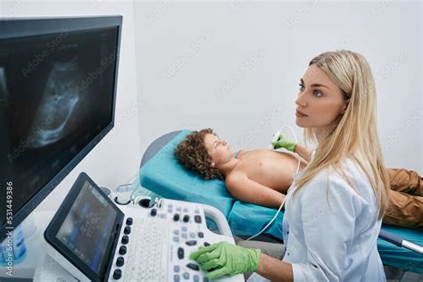 Heart Ultrasound Exam For Male Child With Ultrasound Specialist While