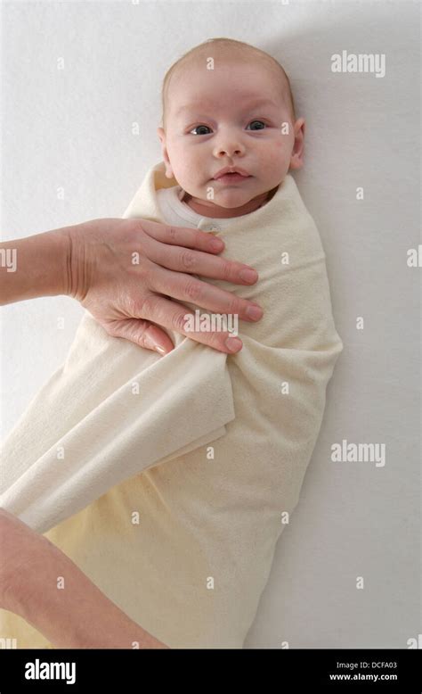 Newborn Baby Wrapped In A Blanket Stock Photo Alamy