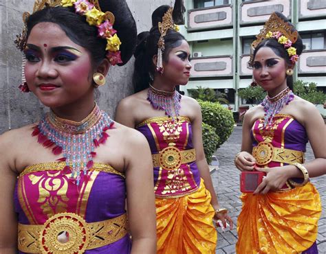 Balinese Girls In Traditional Costumes Gather During A Parade For 2015