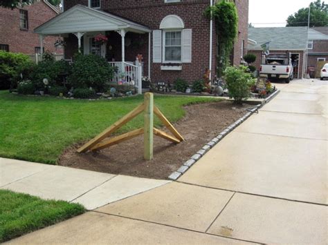 Cleaning and sealing your split rail fence with stain will give it a fresh look and a few more years of protection! Split Rail Landscaped Corner - Landscaping - Contractor Talk
