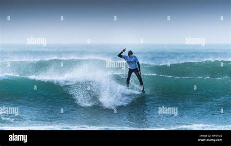 A Surfer Competing In A Longboard Surfing Festival At Fistral Beach In