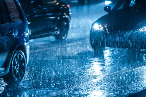 Cars Driving On Wet Road In The Rain With Headlights Dolan Law Firm