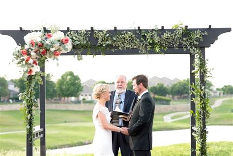 Wooden Wedding Arch With Flowers And Greens