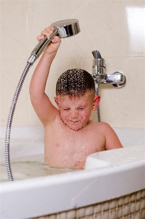 Cute Small Boy Showering In The Bath — Stock Photo © Ampack 48738647