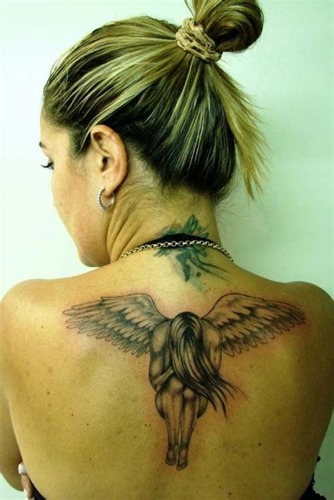 A Woman With A Tattoo On Her Back