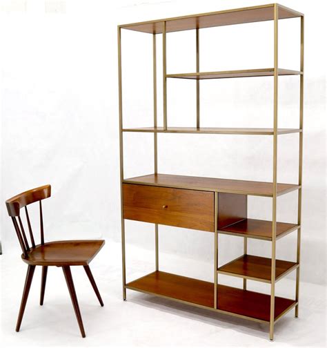 The contemporary silhouette is enlivened with for a classic retro twist, plan it out; Walnut and Brass Etagere Bookcase Shelving Wall Unit ...