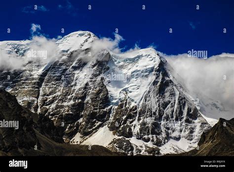 Landscape Of Deep Blue Sky And Ice Capped Peaks Of Himalayan Mountains