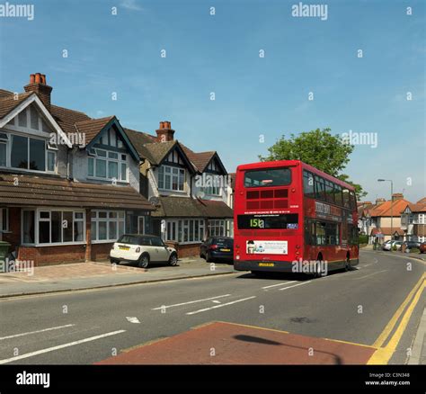 Bus Going Past Semi Detatched Houses Cheam Surrey England Stock Photo