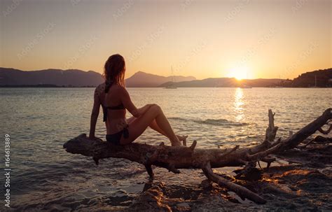 Babe Woman In Bikini Standing And Relax Seeing Sunset On The Sea And Sky Background At Summer