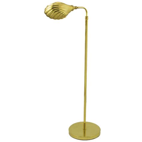 Designed by aerin, with signature chic, european style, clarkson adds sleek and subtle cool to a living room the linen shade is adjustable, so it can be angled to the perfect reading position. Brass Shell Shade Reading Floor Lamp