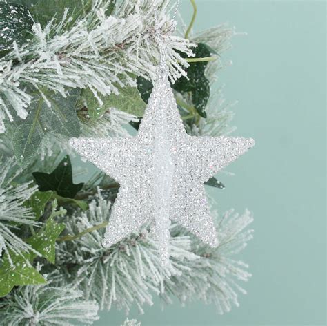 Silver Star Hanging Decoration By The Christmas Home
