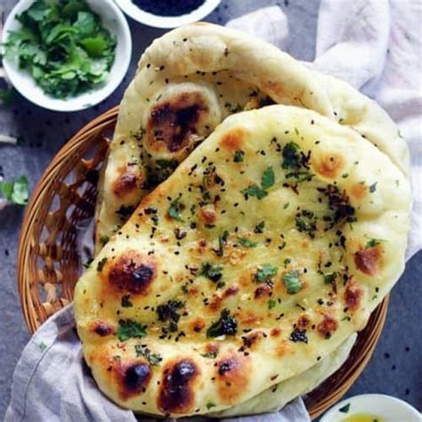 Pinch off small handfuls of dough about the size of a golf ball. How to make Naan Bread at Home like a PRO - Spices N Flavors