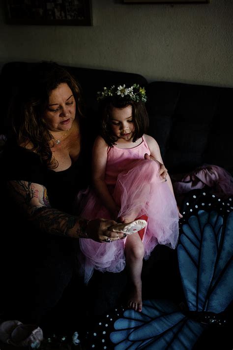 Aunt Helping Niece Put On Ballet Shoes Photograph By Cavan Images Fine Art America