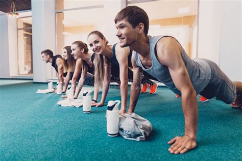 Group Men And Women Performs A Physical Exercise Stock Image Image