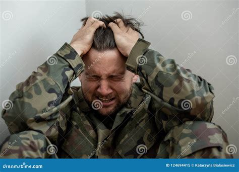 Crying Professional Soldier With Depression And Trauma After War Stock