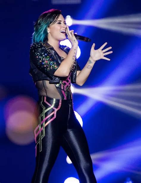 Demi Lovato Rocks A Skin Tight Costume During A Steamy Performance In