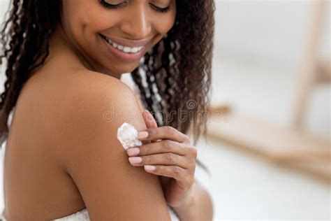Black Woman Applying Body Lotion Stock Photos Free Royalty Free Stock Photos From Dreamstime