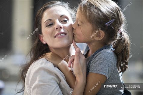 Portrait Of Mother And Daughter Kissing And Embracing — Girl Two