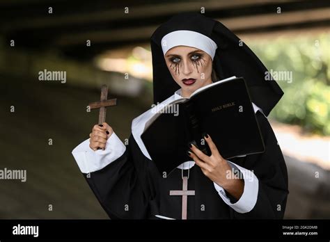 Woman Dressed For Halloween As Nun Outdoors Stock Photo Alamy