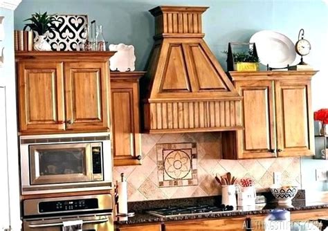 Take advantage of that extra space by using it as storage. Image result for how to decorate on top of cabinets with ...