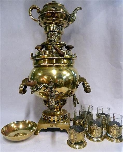 A Russian Brass Samovar With Six Tea Holders And Five Tea Brass