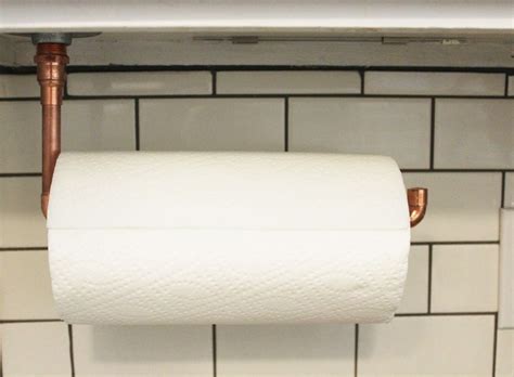 Typical paper towel rolls are 11 inches long, so make sure you space the hooks. DIY Under Cabinet Hanging Copper Paper Towel Holder