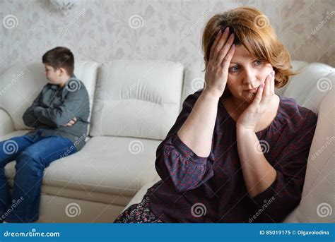 mother and son after quarrel sit on couch stock image image of scandal house 85019175
