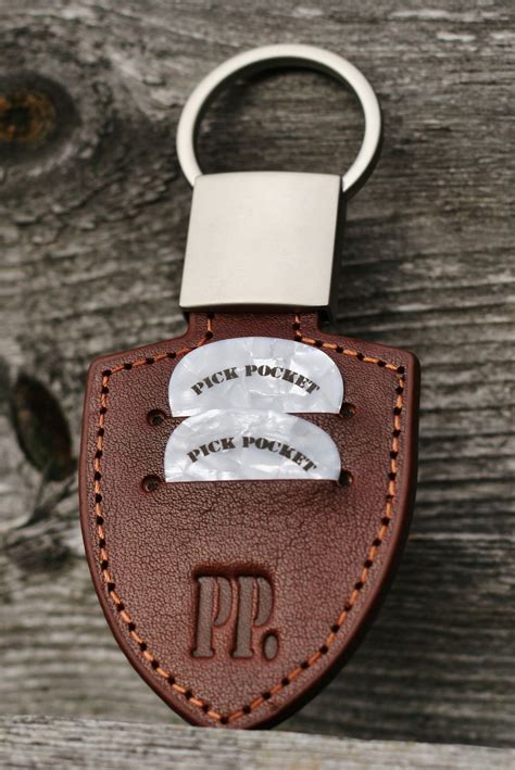 Another guitar product that many guitar players use is the humble guitar pick, or plectrum. Guitar | Leather keychain, Leather gifts, Leather goodies