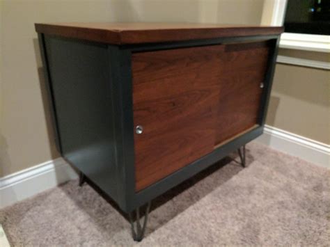 Iron ore is a lighter shade of black than tricorn black, black magic, and caviar. after as a media cabinet. Sherwin Williams iron ore paint, English chestnut stained top with ...