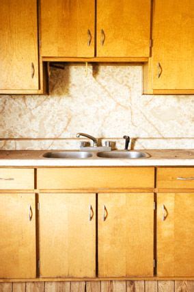 Mix equal parts white vinegar and water in a spray bottle. Cleaning the Impossible | Clean kitchen cabinets, Old ...