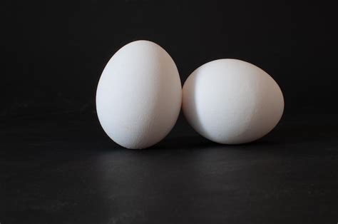 Premium Photo Two Eggs Profile View Of White Raw Chicken Eggs