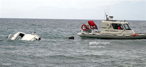 A Boat Which Was Carrying Refugees Is Seen In The Aegean Sea After
