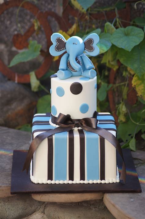 All celebrations call for something sweet. Blue baby shower cake with elephant topper | Blue baby ...