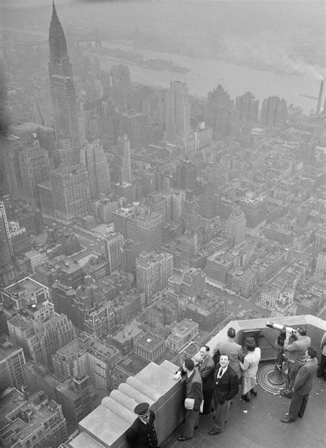 taking in the aerial view of new york city atop the empire state building 1930s r thewaywewere