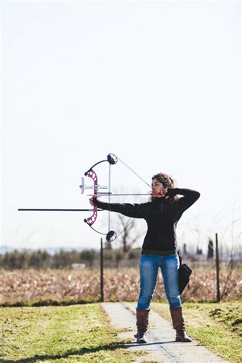 Archer Woman Aiming With Professional Compound Bow Outdoors By