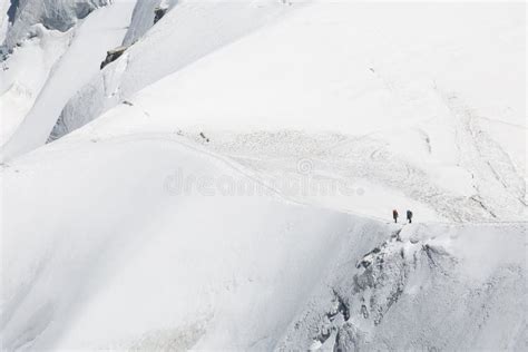 Tied Climbers Climbing Mountain With Snow Field In The French Alps